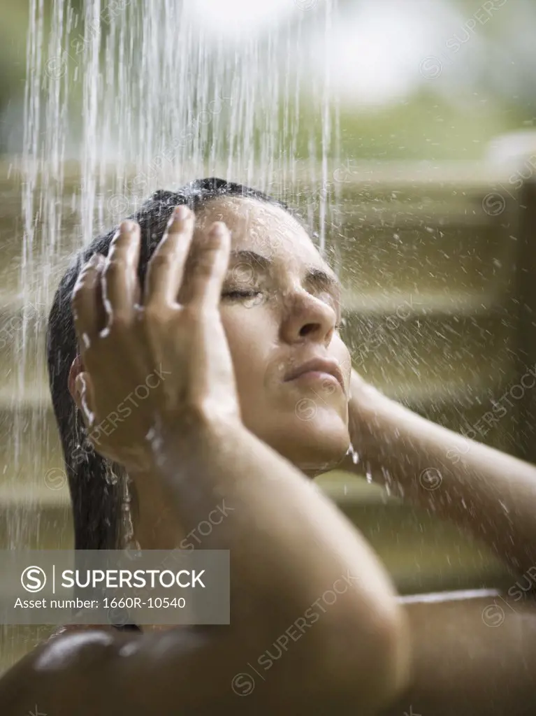 Profile of an adult woman taking a shower