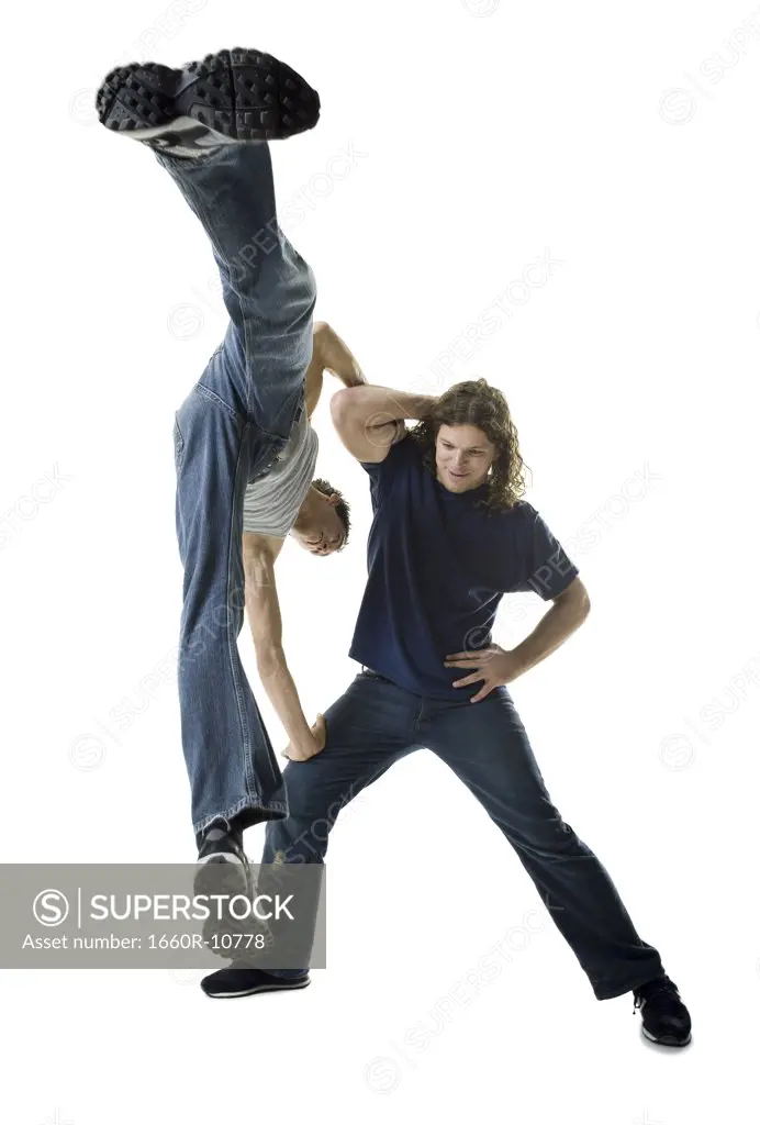 Two young men break dancing