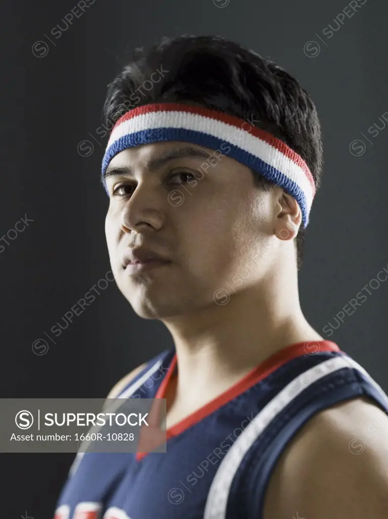 Portrait of a young man in a basketball jersey