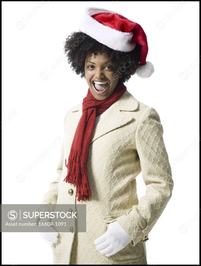 Portrait of a young woman wearing a Santa hat