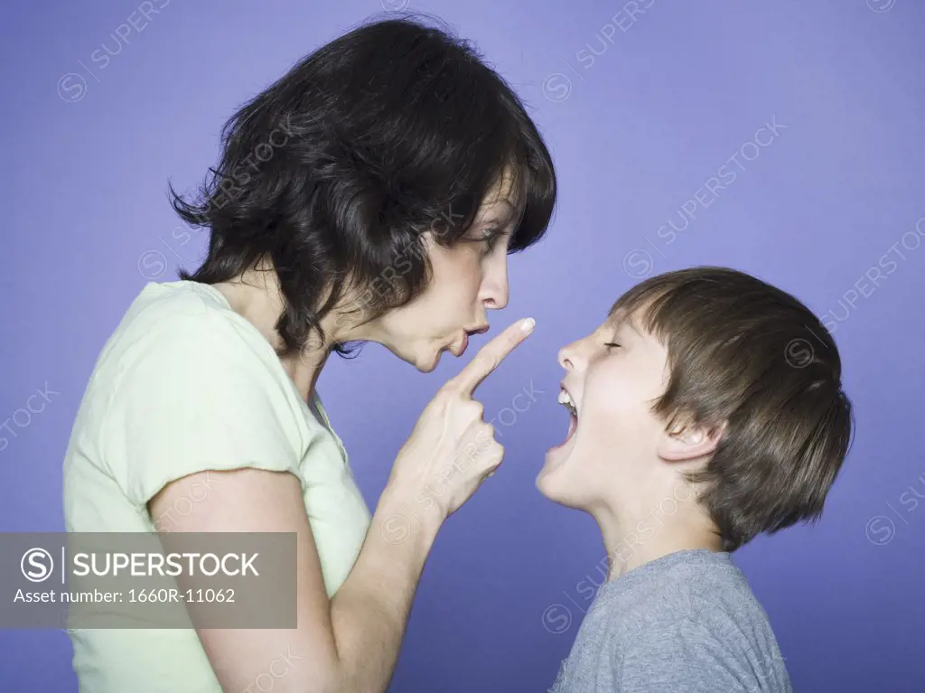 Profile of a mother scolding her son