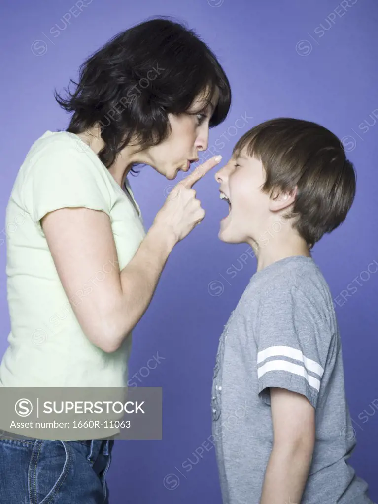 Profile of a mother scolding her son