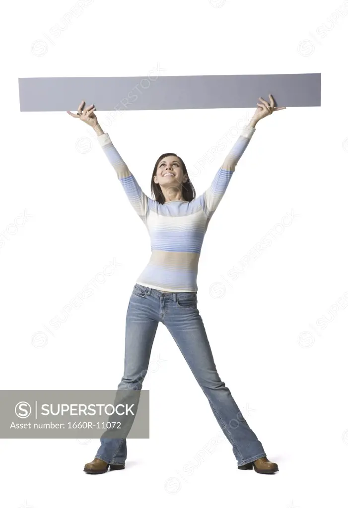 Young woman lifting up a placard