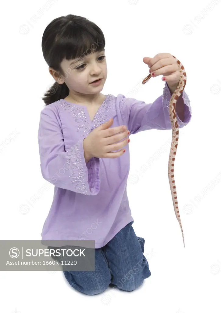 Close-up of a girl holding a snake