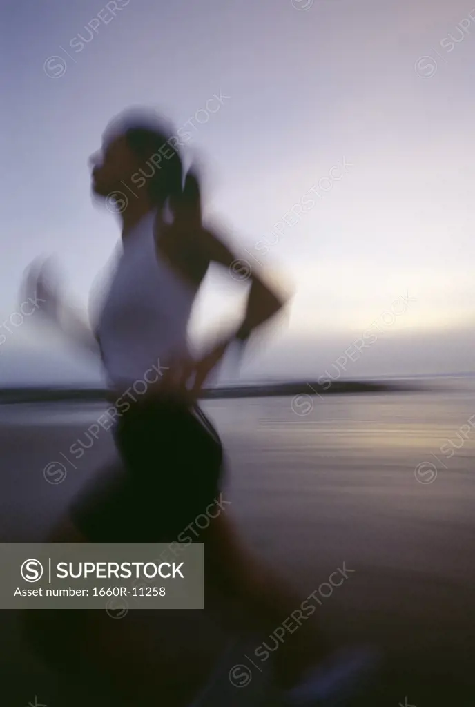 Profile of a mid adult woman running