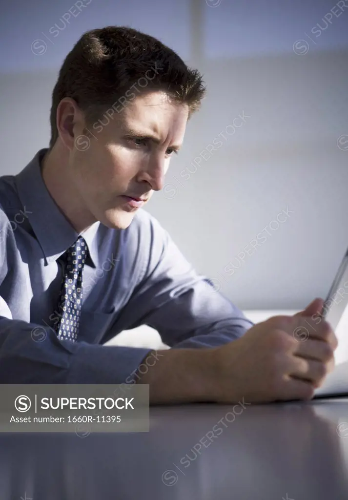 Close-up of a businessman reading