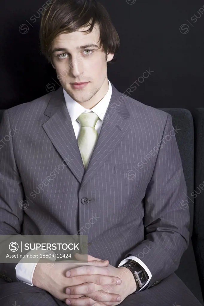 Portrait of a businessman with his hands clasped
