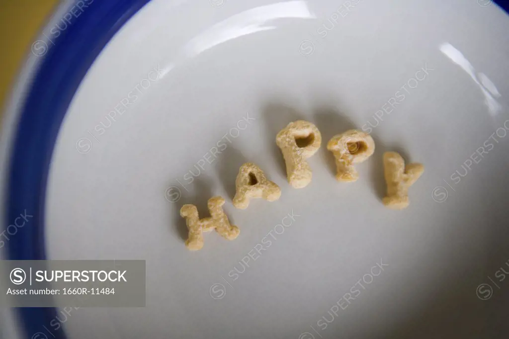 Close-up of alphabet shaped cereal on a plate