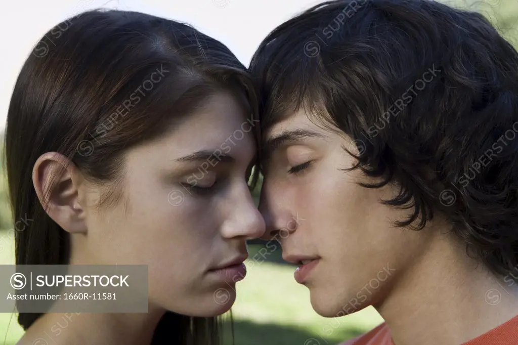Close-up of a teenage couple kissing