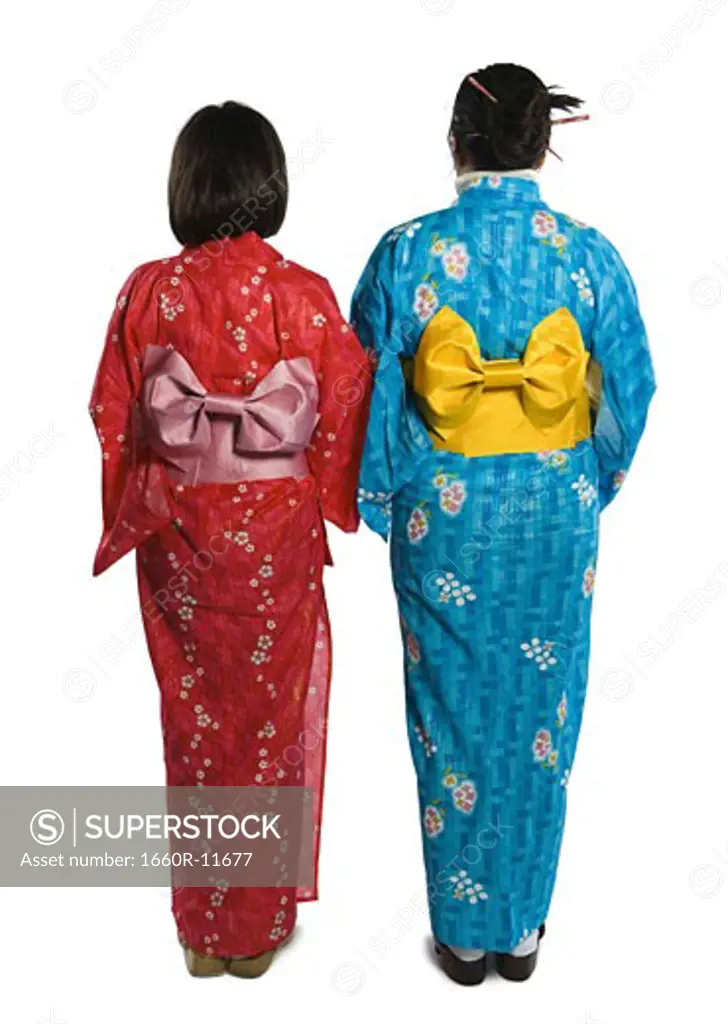 Rear view of two young women wearing kimonos