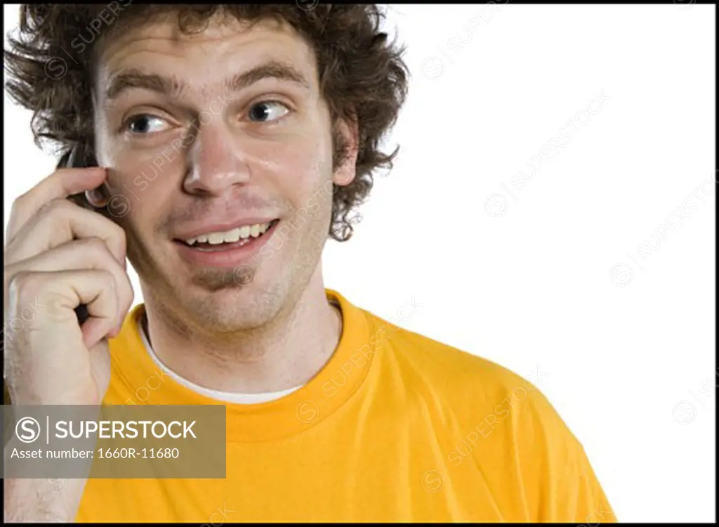 Close-up of a young man talking on a mobile phone