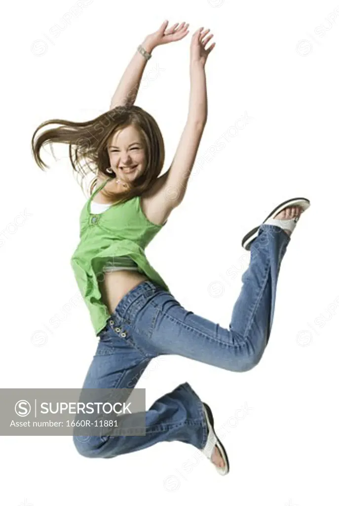 A teenage girl jumping