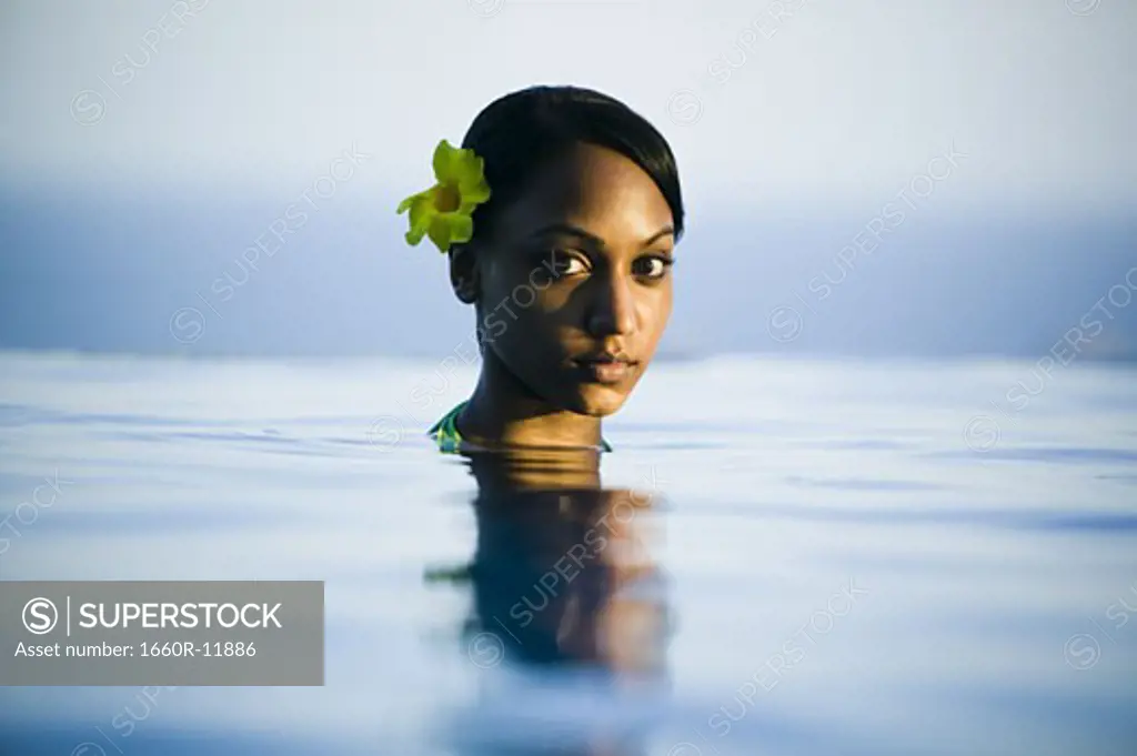 Portrait of a young woman in water