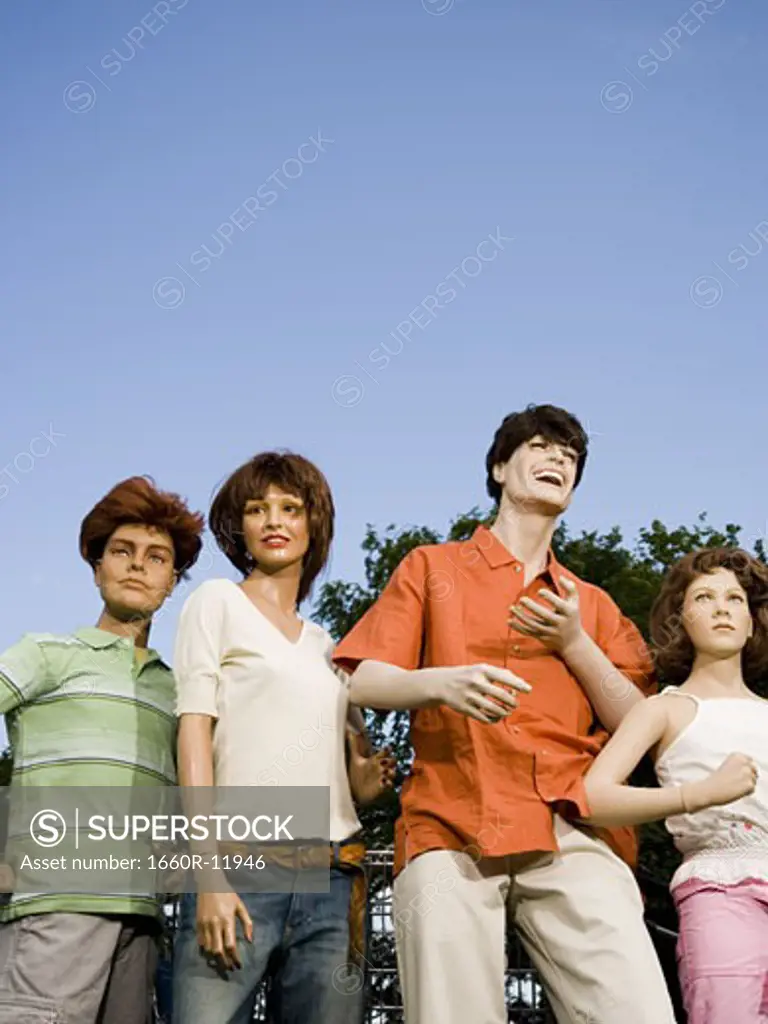 Low angle view of four mannequins portraying a family