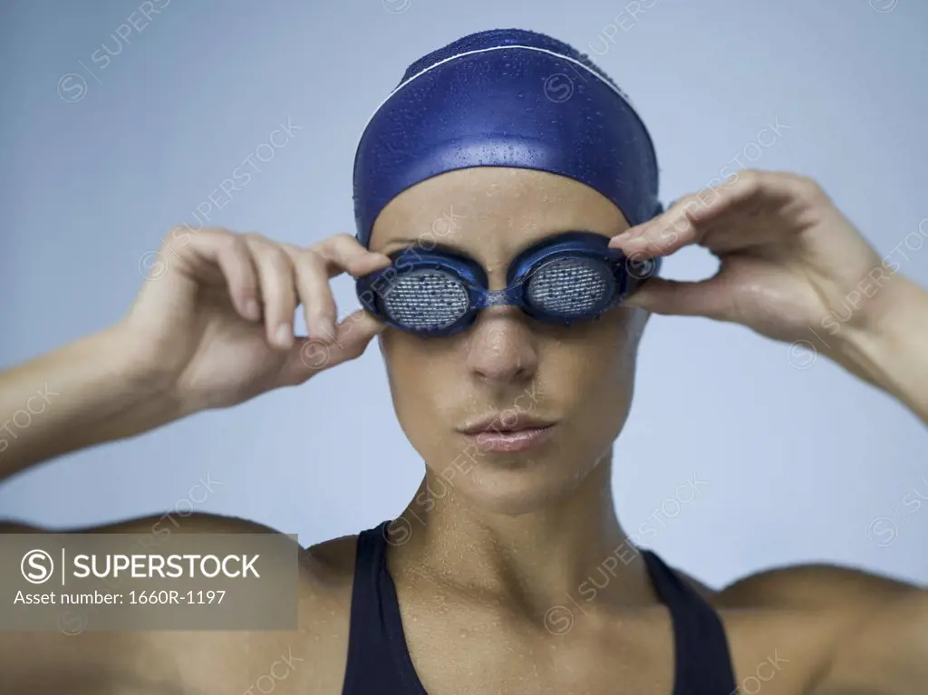 Close-up of an adult woman wearing swimming goggles