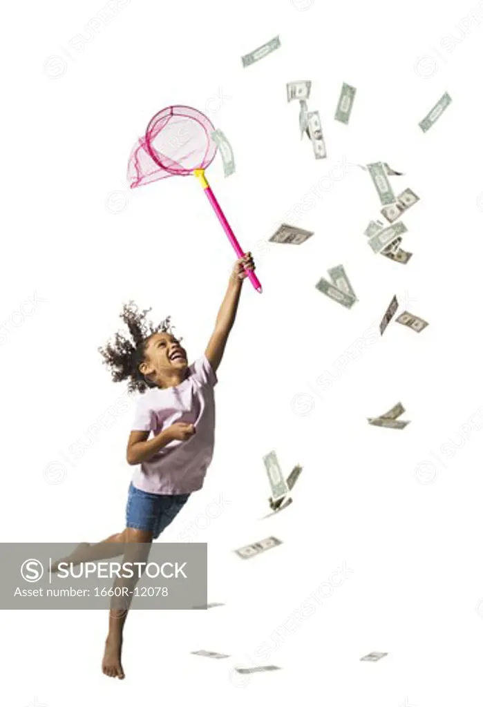 Young girl catching US banknotes with butterfly net