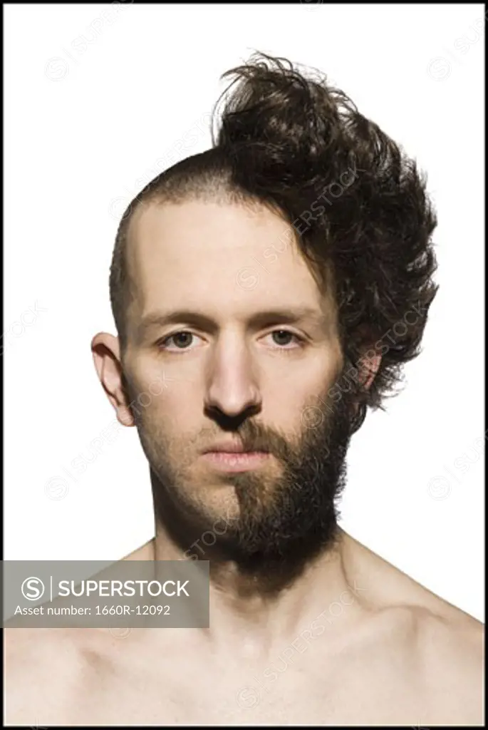 Man with half shaved head and beard
