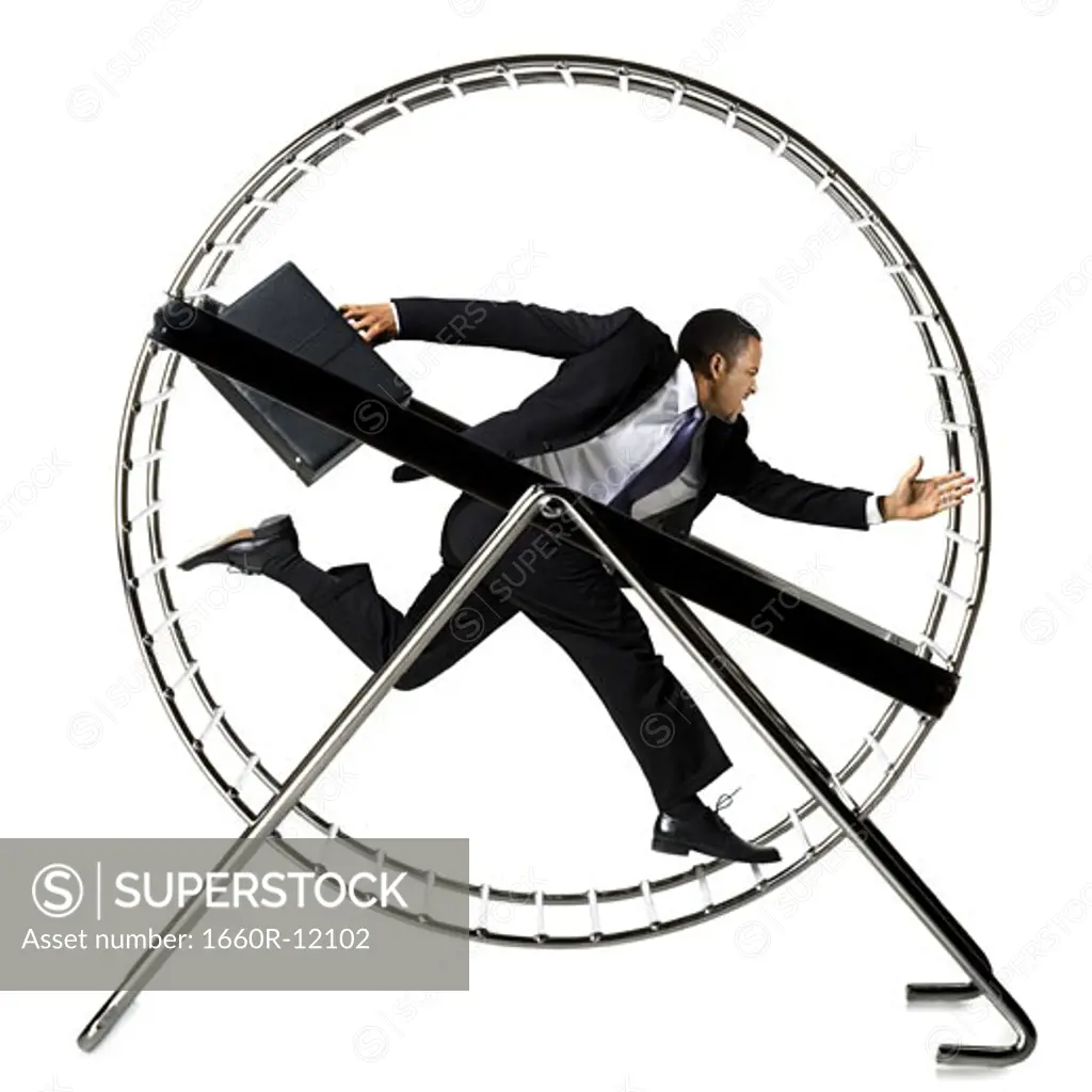 Businessman running in hamster wheel