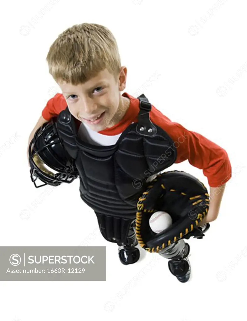 High angle view of a baseball catcher holding a baseball helmet and a catchers mit