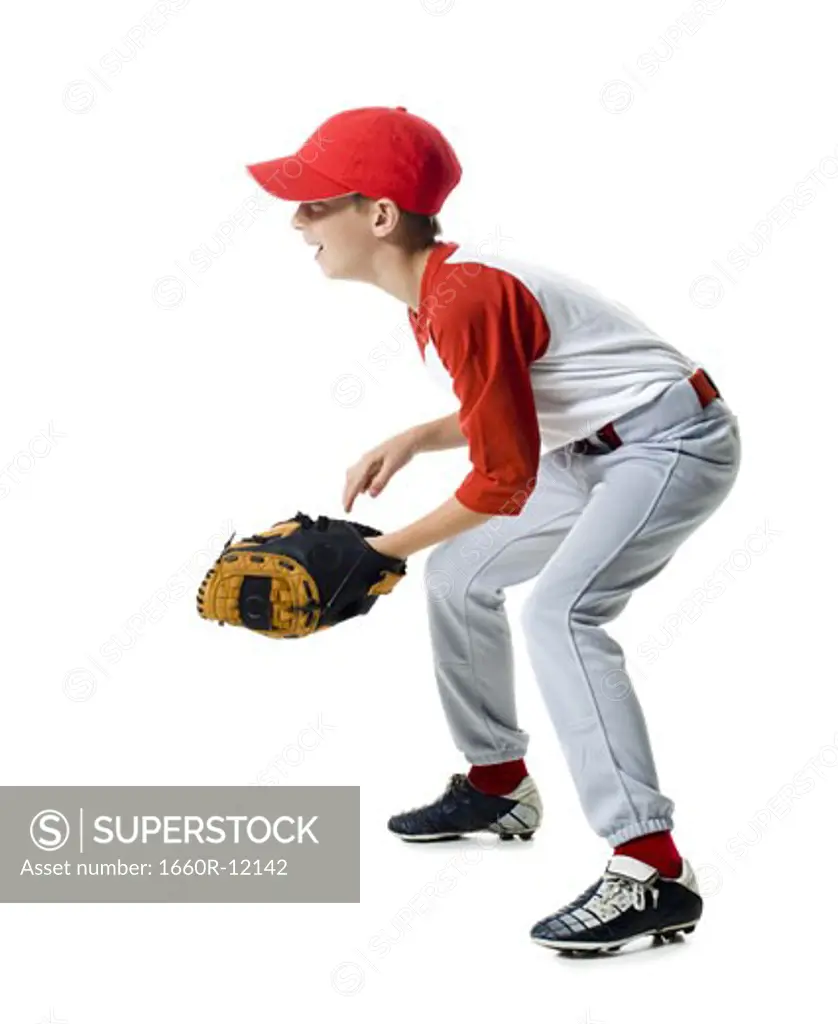 Profile of a baseball player standing in a catching position