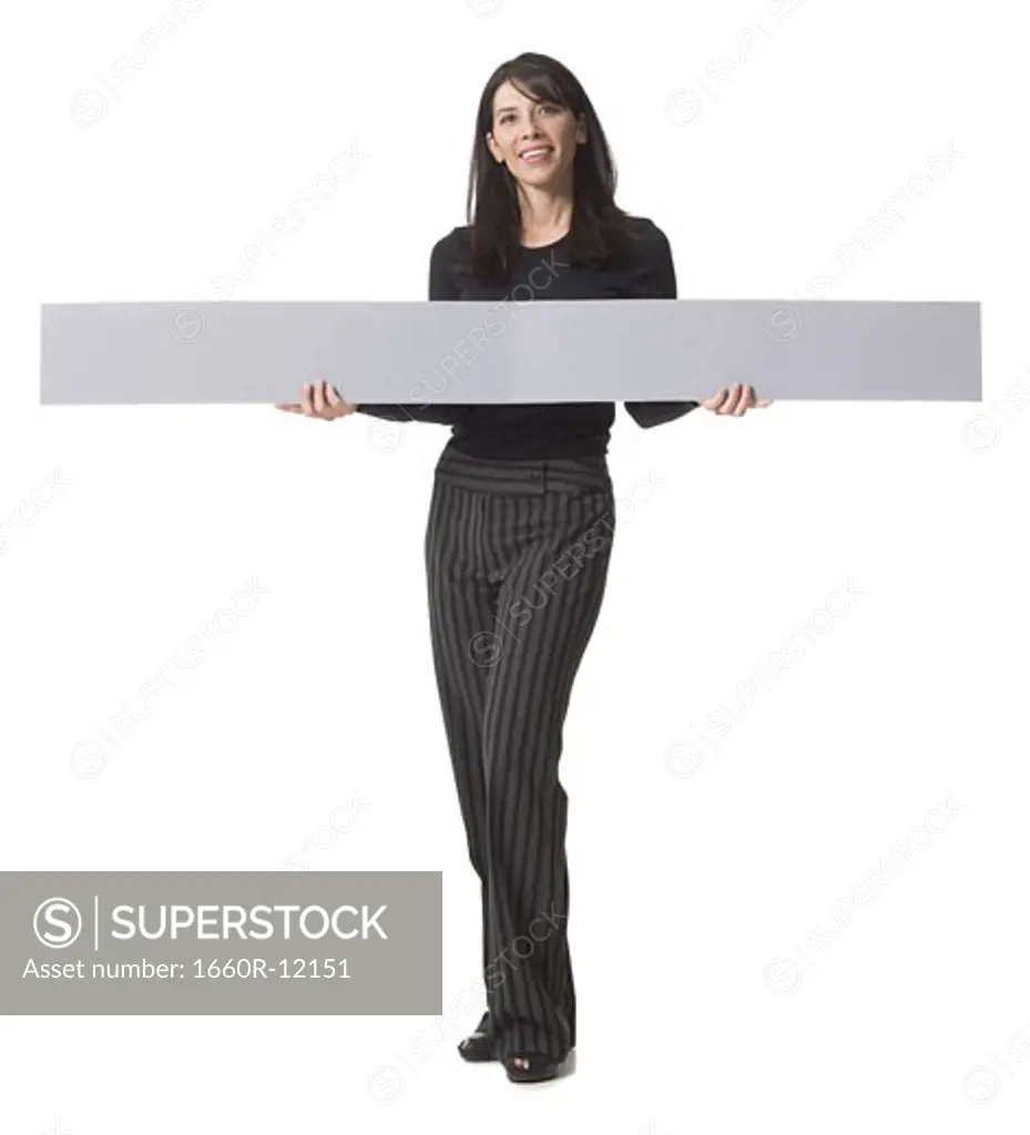 Portrait of a mid adult woman holding a blank sign