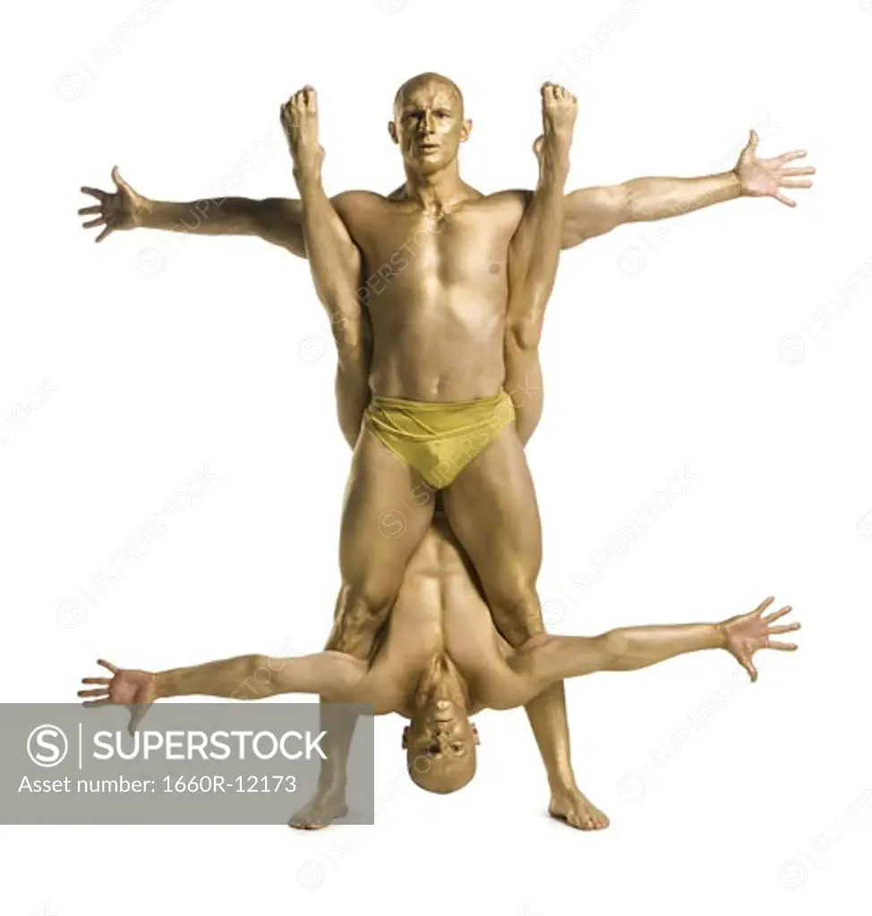 Portrait of two male acrobats performing