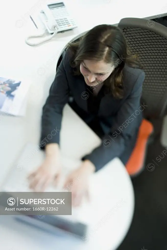 High angle view of a businesswoman using a laptop