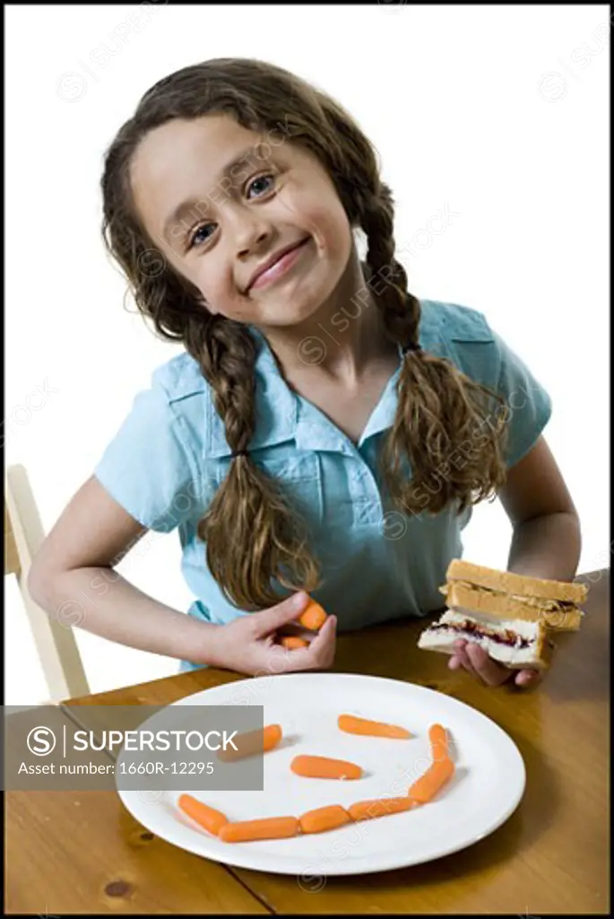 Portrait of a girl eating a sandwich