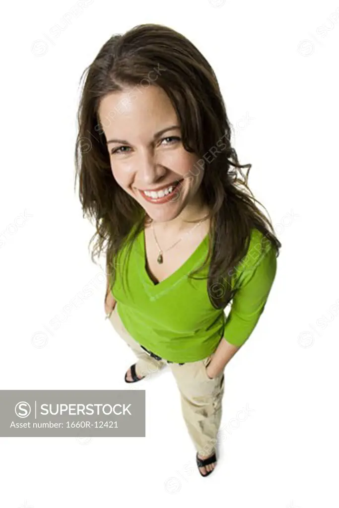 High angle view of a mid adult woman standing with her hands in her pockets