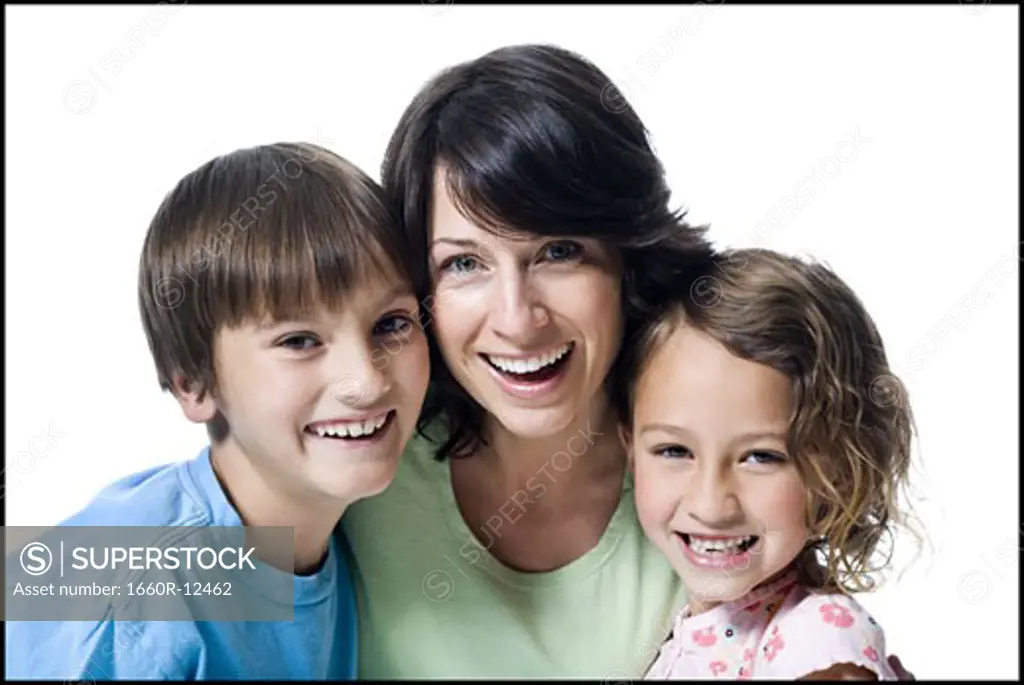 Portrait of a mid adult woman smiling with her son and daughter