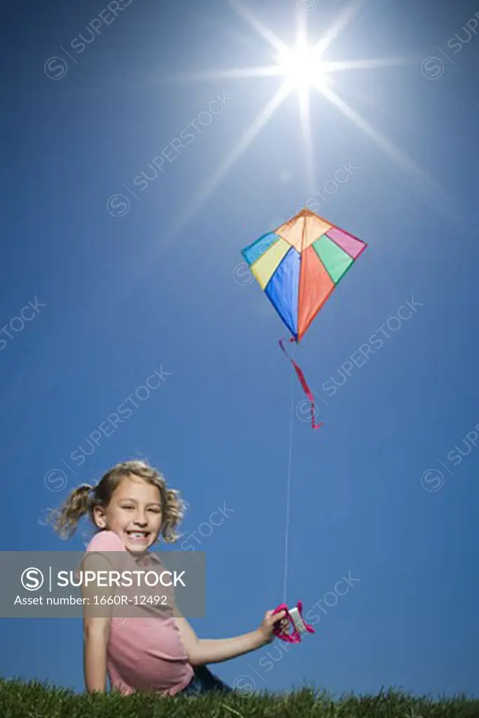 Portrait of a girl flying a kite