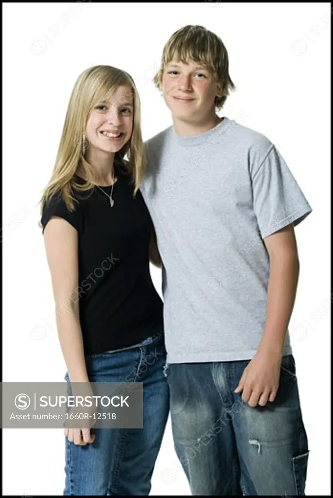 Portrait of a girl and a teenage boy standing together