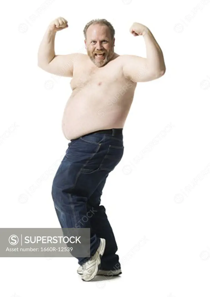 Portrait of a mature man flexing his muscles