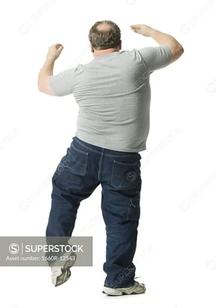 Rear view of a mature man dancing