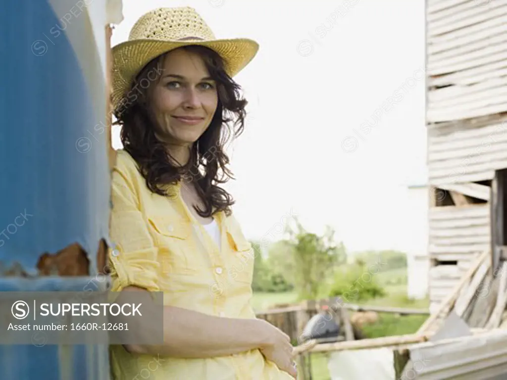 Portrait of a woman wearing a straw hat