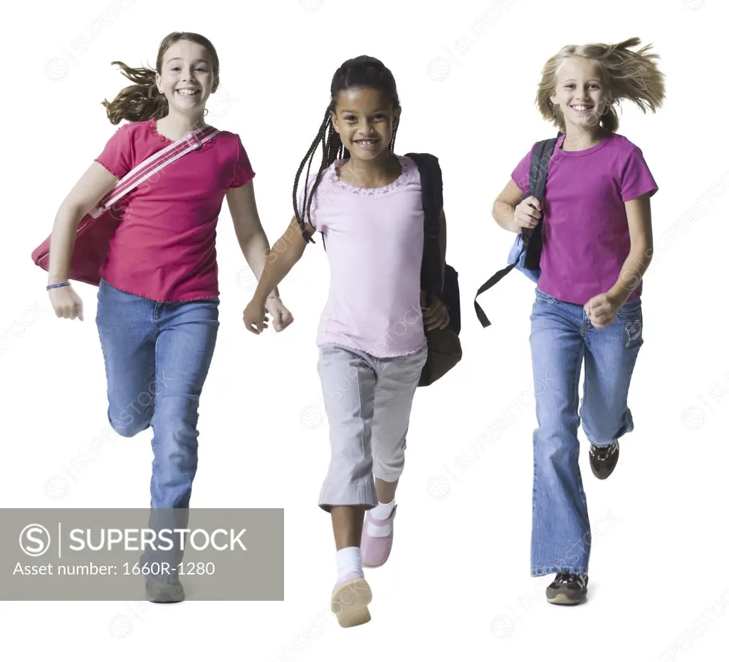 Portrait of three girls running