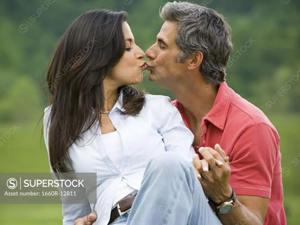 Close-up of a man and a woman kissing each other