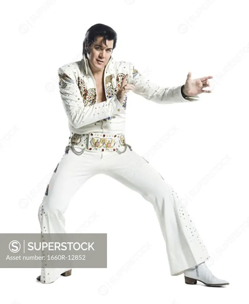 An Elvis impersonator dancing