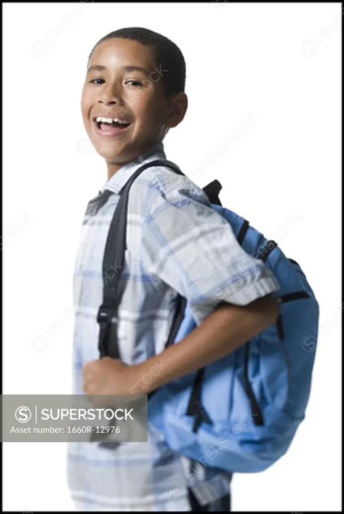 Portrait of a smiling boy with a backpack