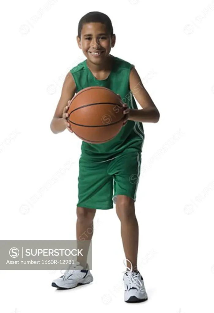 Portrait of a boy holding a basketball