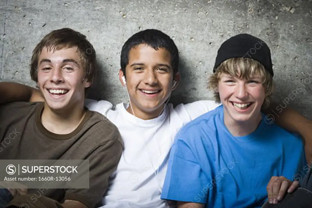Portrait of three teenage boys smiling