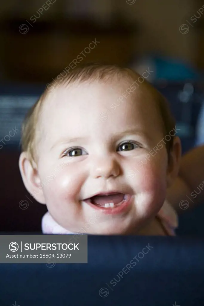 Close-up of a baby girl laughing