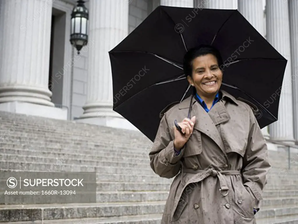 Portrait of a senior woman holding an umbrella