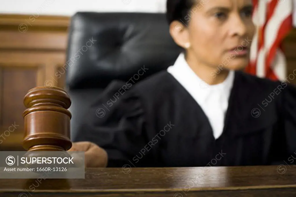 Female judge holding a gavel
