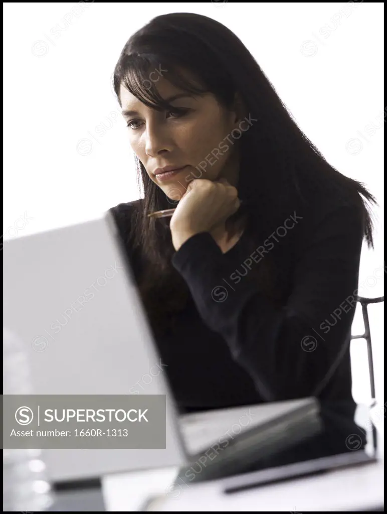Close-up of a mid adult woman using a laptop