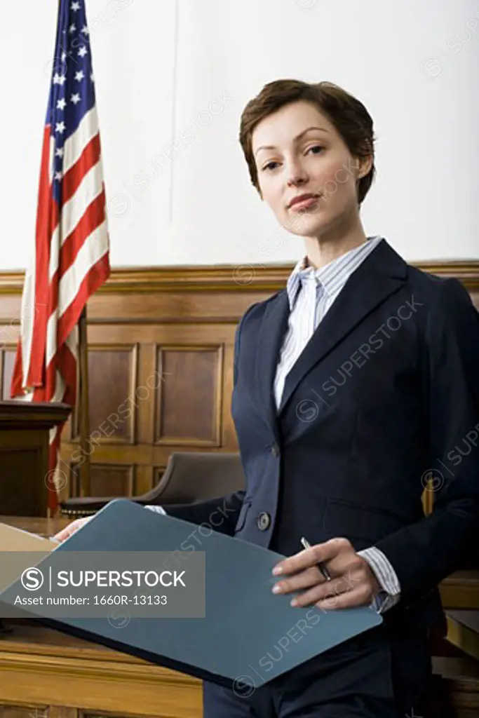 Portrait of a female lawyer standing in a courtroom