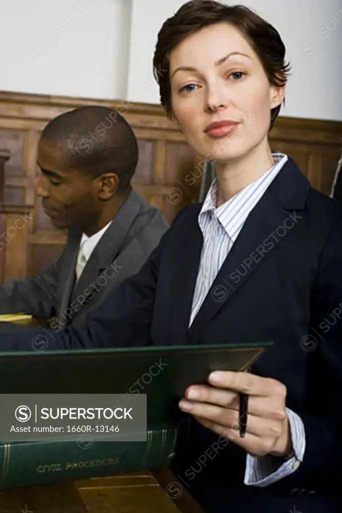 Portrait of a female lawyer sitting in a courtroom