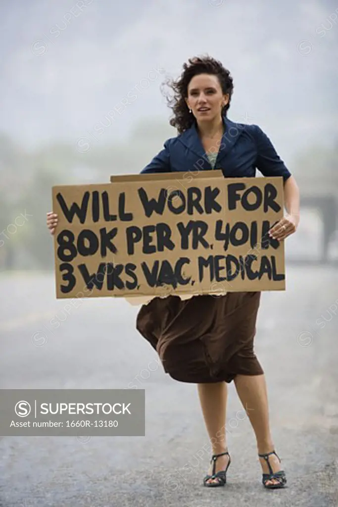 Young woman holding a work-wanted sign