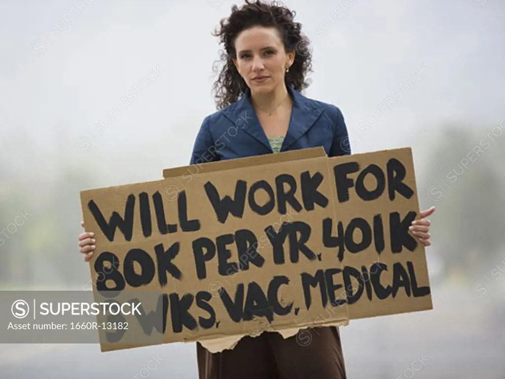 Portrait of a young woman holding a work-wanted sign
