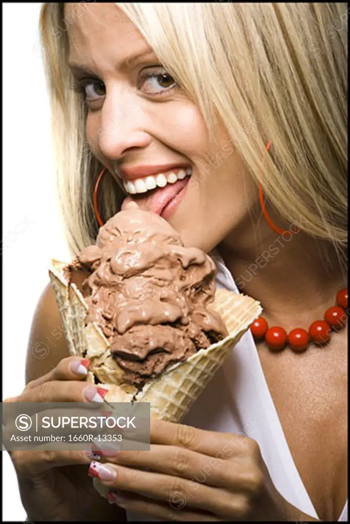 Close-up of a young woman licking an ice-cream cone